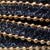 jet black 10 mm flat leather with gold plated balls on the sides