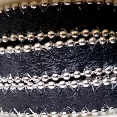10 mm flat black leather with silver balls on the sides